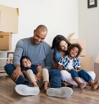 Happy family smiling in new home