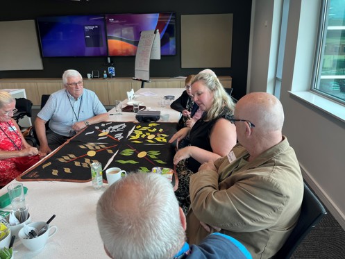 Group of people looking at diagram image making decisions