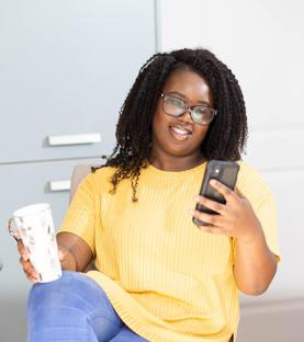 Woman In Kitchen On Phone